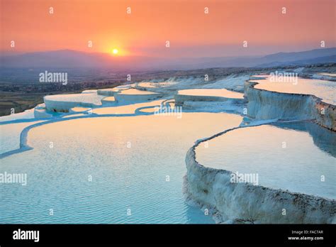 Landscapes at Pamukkale sunset - terraces of carbonate minerals left by the flowing water ...