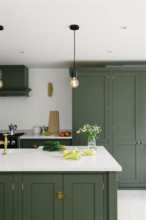 This seaside home was bright and welcoming, and the dark olive paint colour was such a clever ...