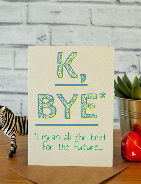 a card with the words k bye on it next to a toy zebra and a potted plant