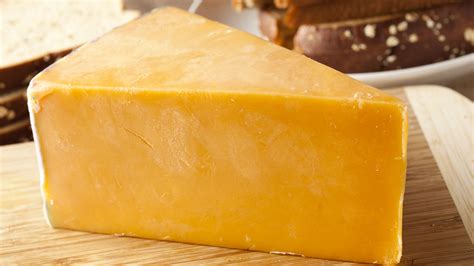 The Fascinating History Behind Why Some Cheese Has That Bright Orange Color