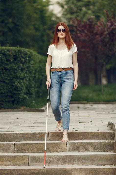 Free Photo | Young blind person with long cane walking in a city | Blind girl, Women, How to ...