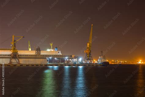 Port terminal of bulk cargo at night time. Industrial port at night Stock Photo | Adobe Stock