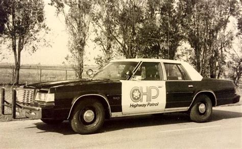 Old Police Car Parked by the Road