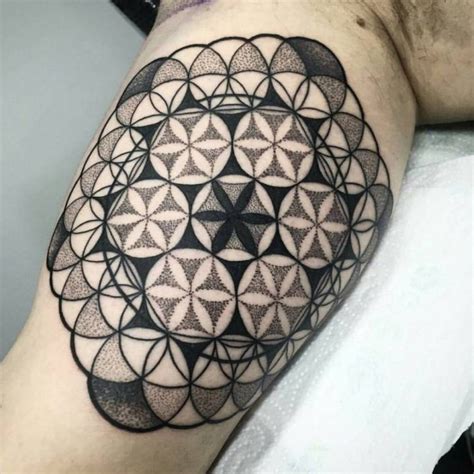 Triangle tattoo with a sacred geometry inside - Tattoogrid.net