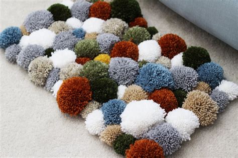 DIY Yarn Pom Pom Rug - Sewrella