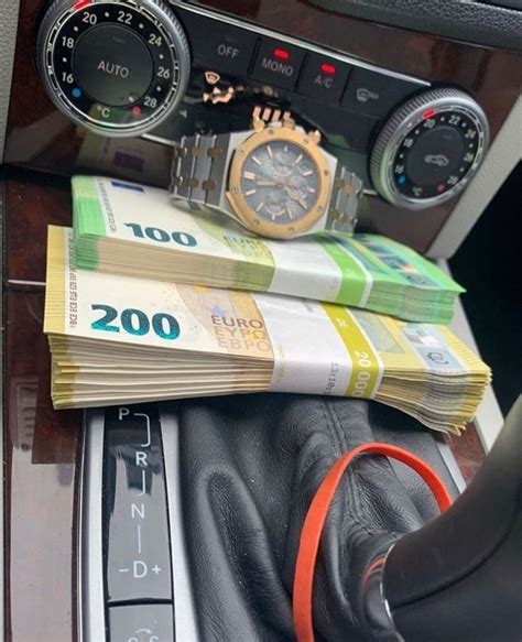 there is a watch and some money in the car