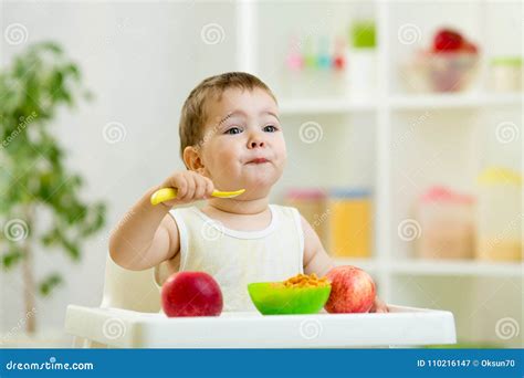 Funny Baby Eating Healthy Food Stock Image - Image of apple, breakfast ...