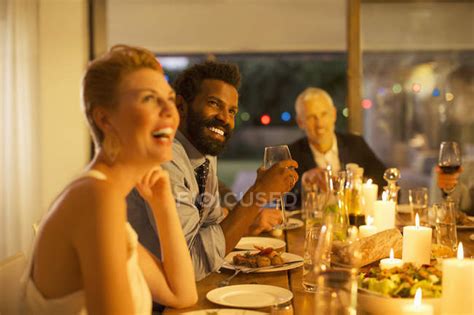 Friends laughing at dinner party — Social event, Blonde Hair - Stock Photo | #199380408