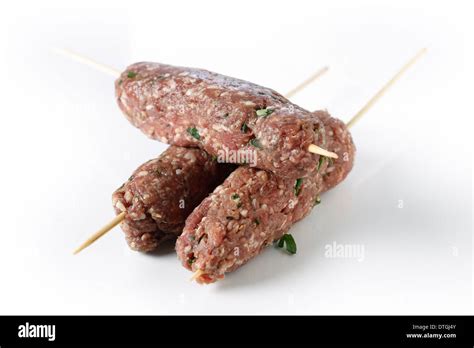 Lamb kofta skewers over a white background Stock Photo - Alamy