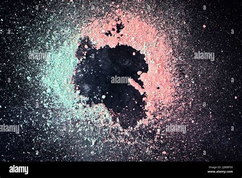 Colorful background of chalk powder. Multicolored dust particles splattered on black background ...