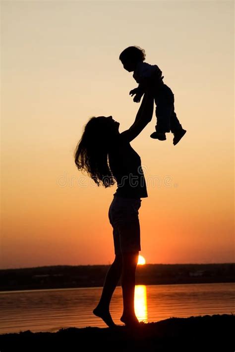 Mother and Daughter Silhouette at Sunset