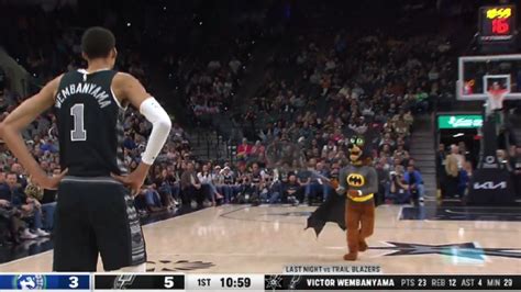 The Spurs mascot dressed up as Batman and chased a loose bat around the court during the ...