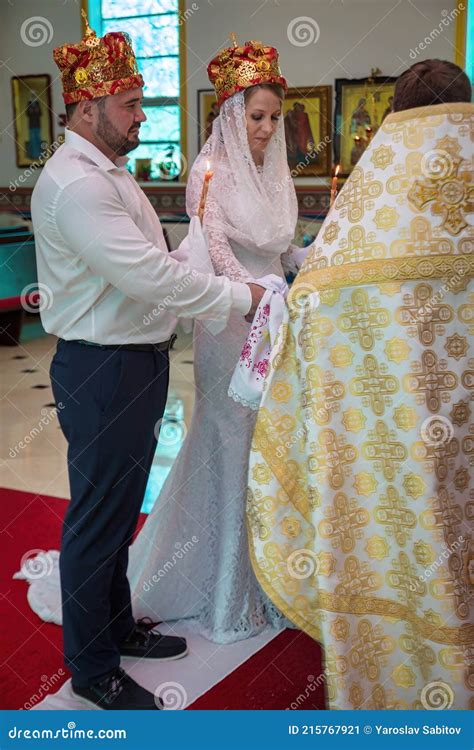 Blonde Woman in Wedding White Dress and Man at Russian Orthodox ...