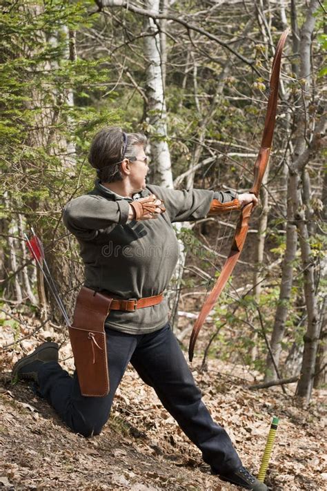 Senior Woman Shooting with a Traditional Bow Editorial Stock Photo - Image of competitor, arrow ...