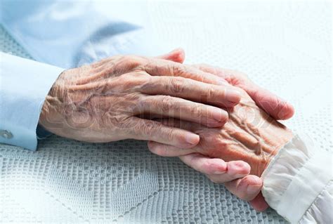 Old people holding hands. Closeup. | Stock Photo | Colourbox