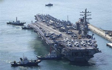 North Korea tests ballistic missile as US aircraft carrier arrives in ...