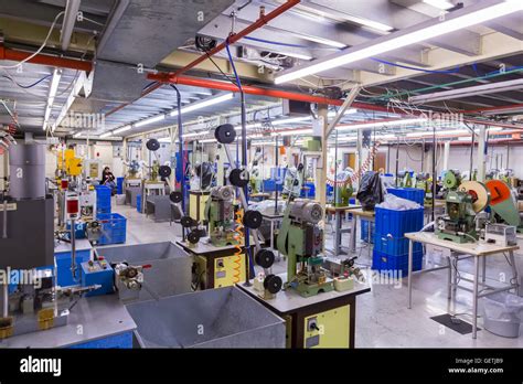 Interior of a factory with small machines Stock Photo - Alamy