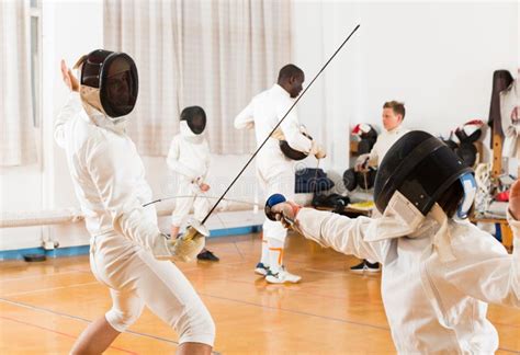 Active Group Practicing Fencing Techniques Stock Photo - Image of ...