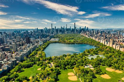 Central Park aerial view in Manhattan, New York. huge beautiful park is surrounded by skyscraper ...