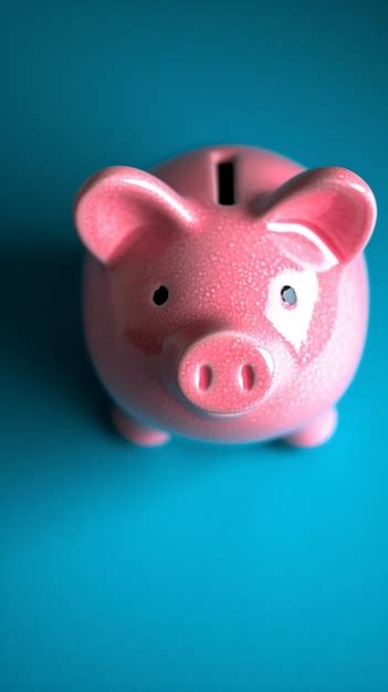 Premium Photo | Blue background contrast Pink piggy bank simple and ...