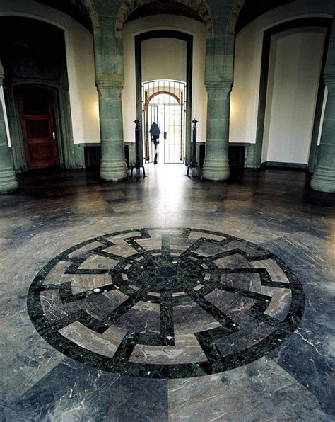 The black sun mosaic in the Obergruppenführersaal, or General's Hall at Wewelsburg Castle, often ...