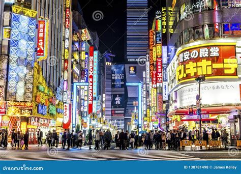 Shinjuku, Tokyo - Neon Signs Illuminate Busy Neighborhood at Night ...