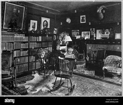 Interior of Sagamore Hill with bookcases and fireplace Stock Photo - Alamy