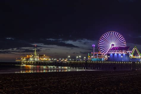 Santa Monica Pier At Night Photograph by Aaron Jettleson