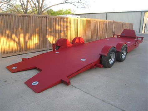 The trailer shown below is a 24' Drop n Load, with 5200lb axles, has LED Lights, Options include ...