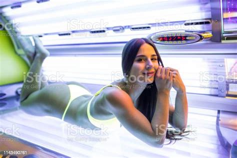 Young Beautiful Lady Lying On A Tanning Bed At Health Spa Stock Photo ...