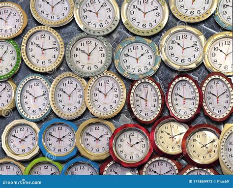 Many Wall Clocks on the Wall Stock Image - Image of contrasting, clock ...