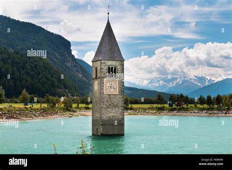 The old church tower of Reschen in the reservoir Lake Reschen, Italy Stock Photo - Alamy