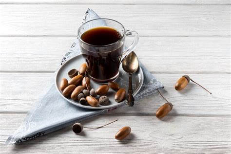 Premium Photo | Acorn coffee in a glass is a tonic drink with a coffee flavor, rich color and ...