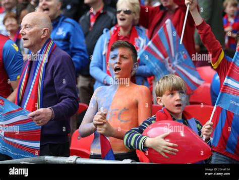 A young Crystal Palace fan gets behind his side during the Emirates FA ...