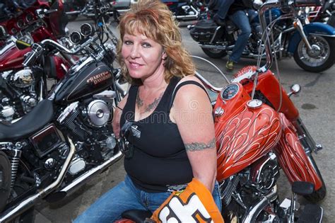 Woman Rider Sitting On Her Bike In The City Of Sturgis, In South Dakota ...