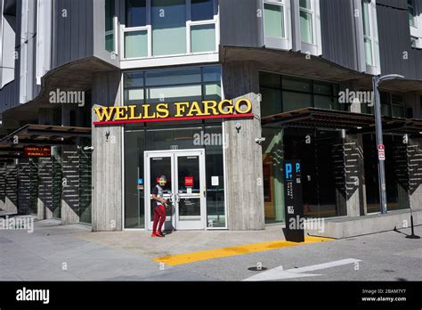 A man walks past a branch of Wells Fargo Bank in the SoMa District of ...