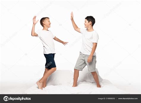 Cheerful Brothers Giving High Five While Standing Bed Isolated White ...