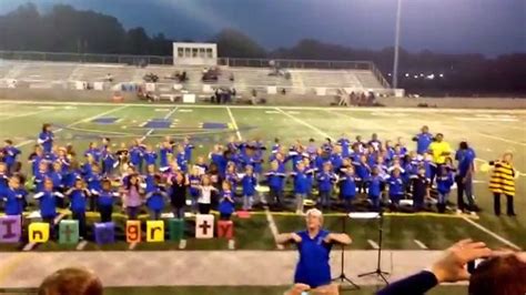 Olive Branch Elementary singing at the game - YouTube