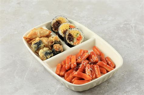 Premium Photo | Korean street food set kimbap topokki mandu and gimmari