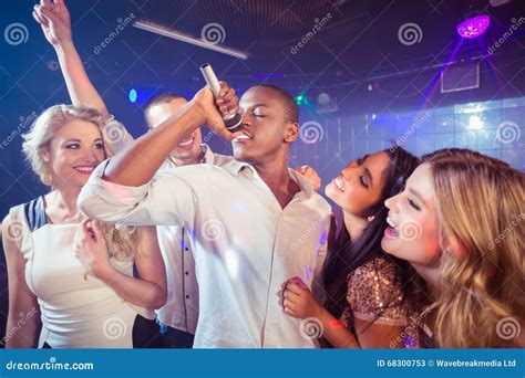 Happy Friends Singing at the Karaoke Stock Image - Image of five ...