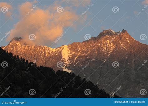 Sunrise over alpine peaks stock photo. Image of rock - 22365634