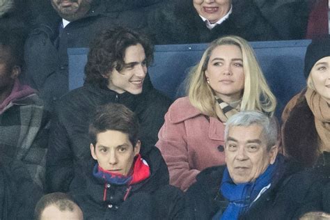 FLORENCE PUGH and Timothee Chalamet at PSG Match at Parc Des Princes in ...