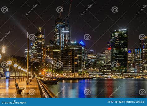 Circular Quay at Sydney Harbor at Night with Light Reflections in the ...