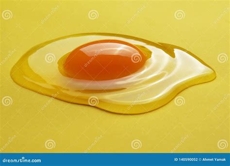 Raw Egg Yolk on the Yellow Background Stock Photo - Image of healthy ...