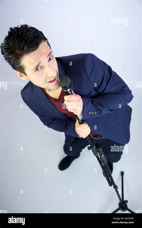 Singer with microphone Stock Photo - Alamy