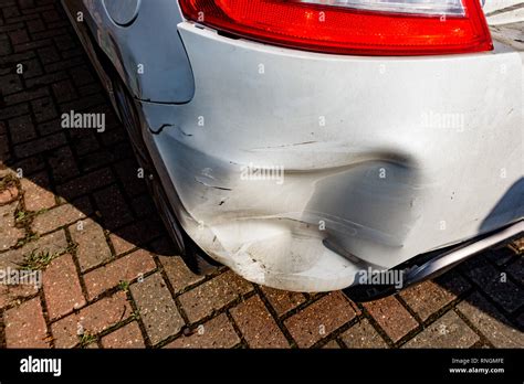 Car Crash and Car Damage; White vehicle rear bumper damage Stock Photo - Alamy