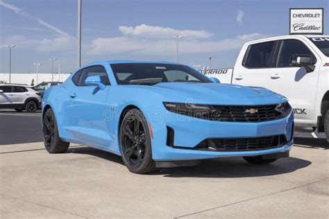 Chevrolet Camaro Display at a Dealership. Chevy Offers the Camaro in Coupe or Convertible Models ...