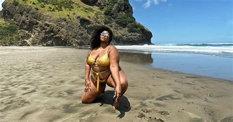 Lizzo Shows Off Her Curves in Gold Cutout Swimsuit in Sexy Beachside Photo Shoot