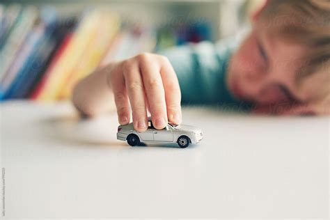 "Child Playing With A Toy Car" by Stocksy Contributor "Sally Anscombe ...