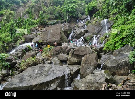 Tourists enjoying the hilly 'Mayabi Jhorna' waterfalls located at the ...